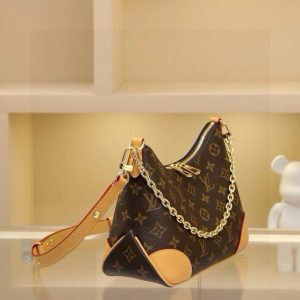 Alternative view of Odeon Small Handbag, featuring Monogram canvas and reinforced leather trim for a vintage-inspired look. An adjustable strap allows for shoulder or crossbody carry, while a smooth zipper opening provides easy access to essentials. Dimensions: 27.0 x 16.0 x 10.0 cm